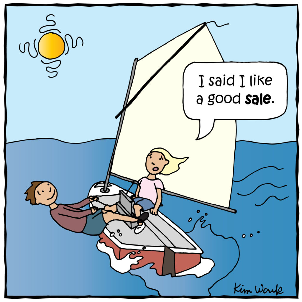 A cartoon shows two people sailing. The woman says, 'I said I like a good sale,' as the man tilts the small sailboat on the water under a sunny sky.