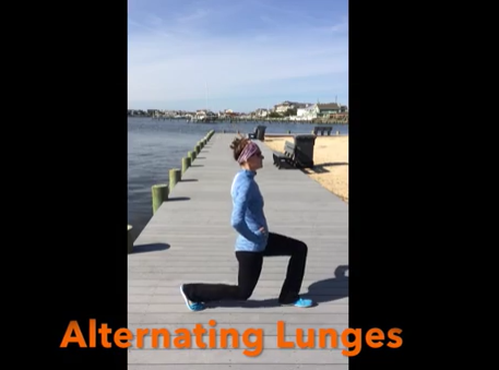 A person in athletic clothing performs a lunge on a boardwalk beside water, with hands on hips. The words 'Alternating Lunges' appear in orange text at the bottom of the image.