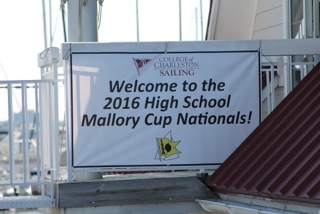 A banner reads: 'Welcome to the 2016 High School Mallory Cup Nationals!' with the College of Charleston Sailing logo and a yellow star logo, displayed on a porch railing.