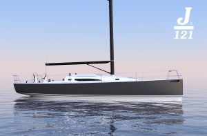 A sleek, modern sailboat with a dark hull and tall mast floats on calm water against a pastel-colored sky. The boat has minimal rigging and the 'J/121' logo is displayed in the top right corner.