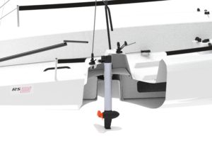 A close-up view of the stern of a white sailboat, showing a partially transparent section that reveals the internal structure and a small electric motor mounted at the center of the transom.