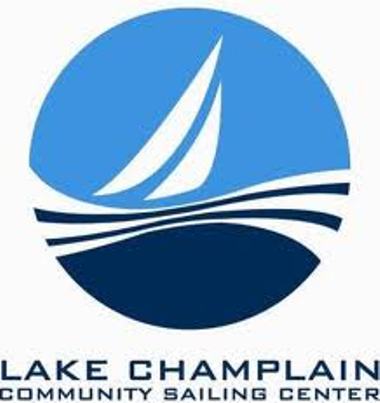 Logo for Lake Champlain Community Sailing Center featuring a stylized white sailboat on blue water waves inside a blue circle, with the organization’s name written below in uppercase letters.