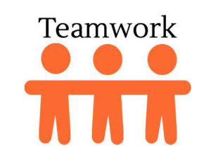 Three orange stick figures standing side by side with arms linked, symbolizing unity, below the word "Teamwork" in bold black letters.