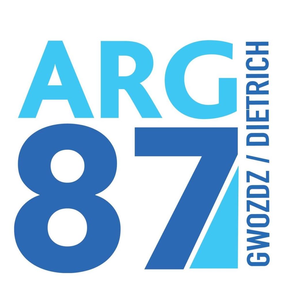 Large blue and light blue text reads "ARG 87" with "GWOZDZ / DIETRICH" written vertically on the right side. One section of the number 7 is highlighted in light blue.