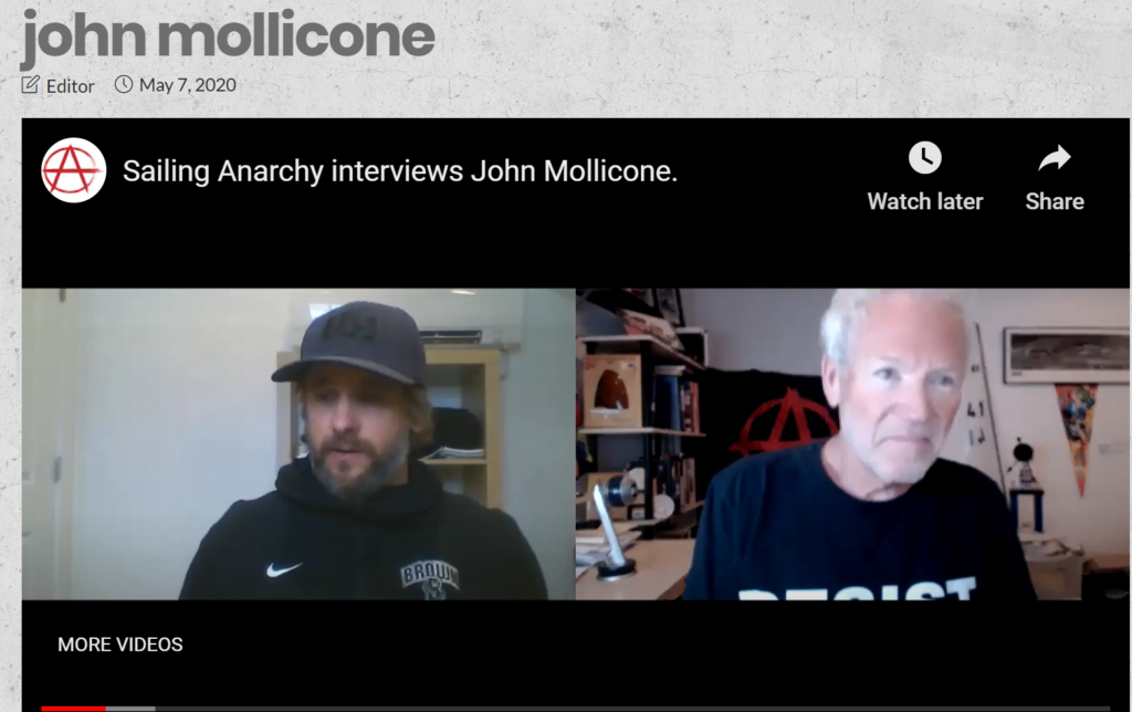 Screenshot of a YouTube interview titled 'Sailing Anarchy interviews John Mollicone,' showing two men talking in a video call. The left man wears a dark hoodie and cap; the right man wears a 'RESIST' shirt.