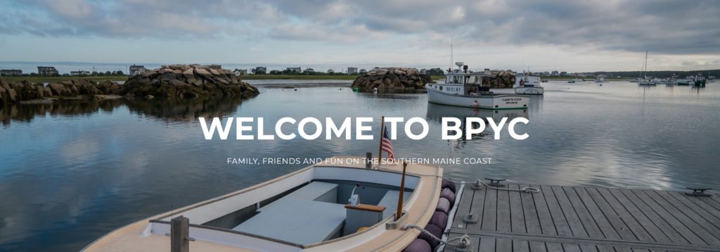 Small boats docked by a pier on calm water with rocks, greenery, and houses in the background under a cloudy sky. Text reads "Welcome to BPYC. Family, friends and fun on the Southern Maine coast.