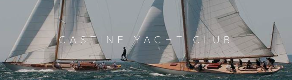 Two classic sailboats with white sails race on the water under a clear sky, with 'CASTINE YACHT CLUB' written in white capital letters across the center.