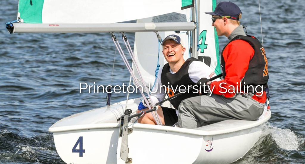 Two people are smiling and sailing a small boat with the number 4 on the water. They wear life jackets and hats. Text across the image reads, 'Princeton University Sailing.