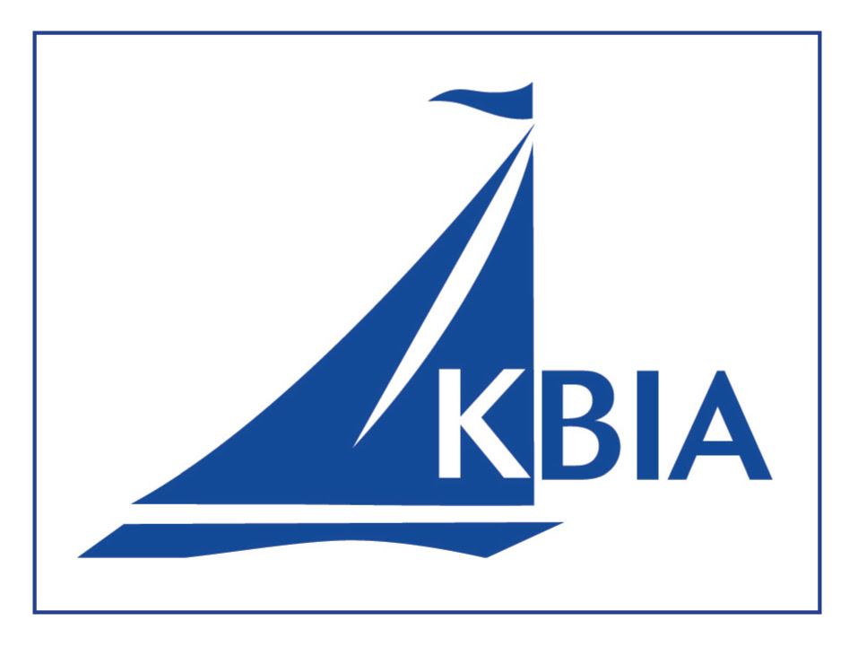 A blue stylized sailboat with the letters 'KBIA' to the right of the sail, all enclosed within a thin blue rectangular border.