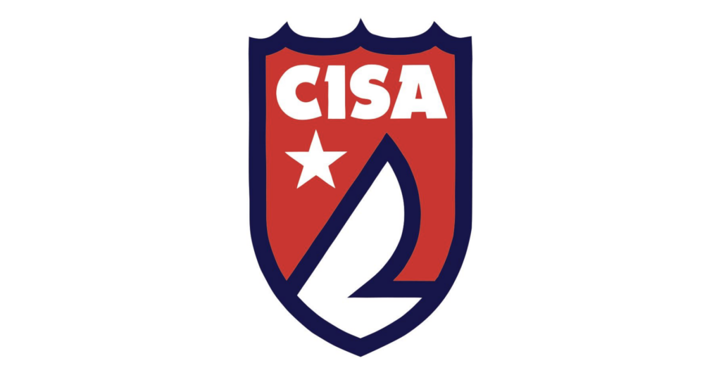 A red shield outlined in blue with the white letters 'CISA' at the top, a white star to the left, and a stylized white sailboat shape below.