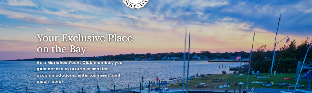 A scenic view of a yacht club marina at sunset, with boats docked, a calm bay, American flags, and wooded shoreline in the background. Text reads: 'Your Exclusive Place on the Bay' and info about club membership.