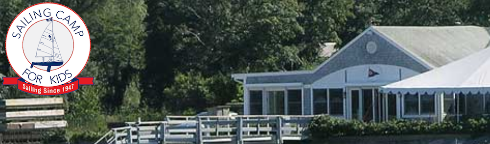 A white boathouse with a dock and a tent sits by the water, surrounded by trees. A circular “Sailing Camp for Kids” logo with a sailboat is in the upper left corner.