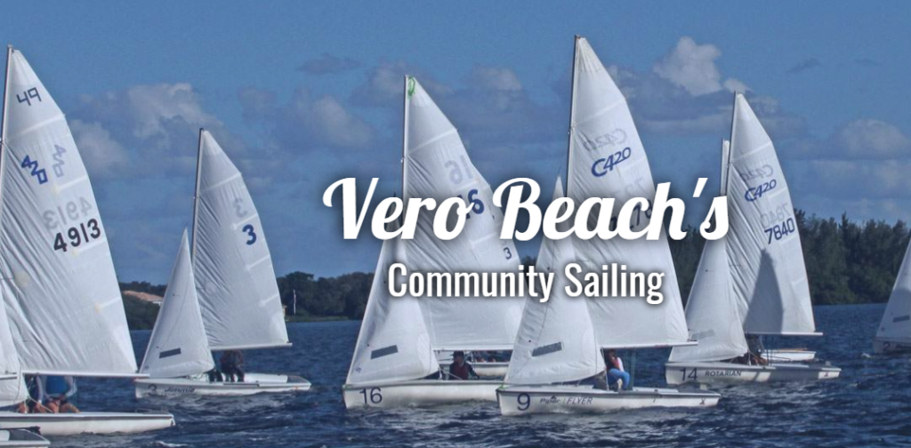 Several small white sailboats with sails up are racing on a blue lake under a partly cloudy sky, with the text 'Vero Beach's Community Sailing' overlaid in the center.