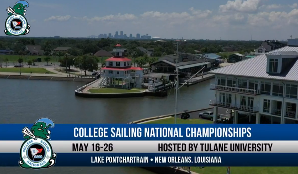Aerial view of a waterfront marina with a red-roofed lighthouse and nearby buildings. Text overlay reads: 'College Sailing National Championships, May 16-26, Hosted by Tulane University, Lake Pontchartrain, New Orleans, Louisiana.