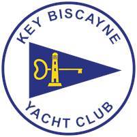 A round logo for Key Biscayne Yacht Club, featuring a blue triangle with a yellow lighthouse and key inside, surrounded by the club name in blue text on a white background.