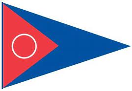 A triangular flag with a blue background, a red triangle on the left side, and a white circle outlined in the center of the red triangle.