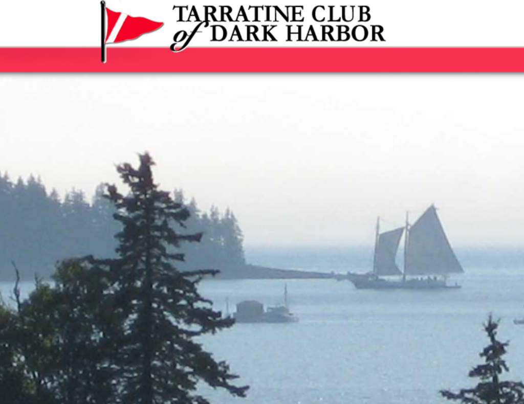 A sailboat glides on calm water near a forested shoreline at sunset. The image is topped with a red banner and the Tarratine Club of Dark Harbor logo featuring a red pennant flag.