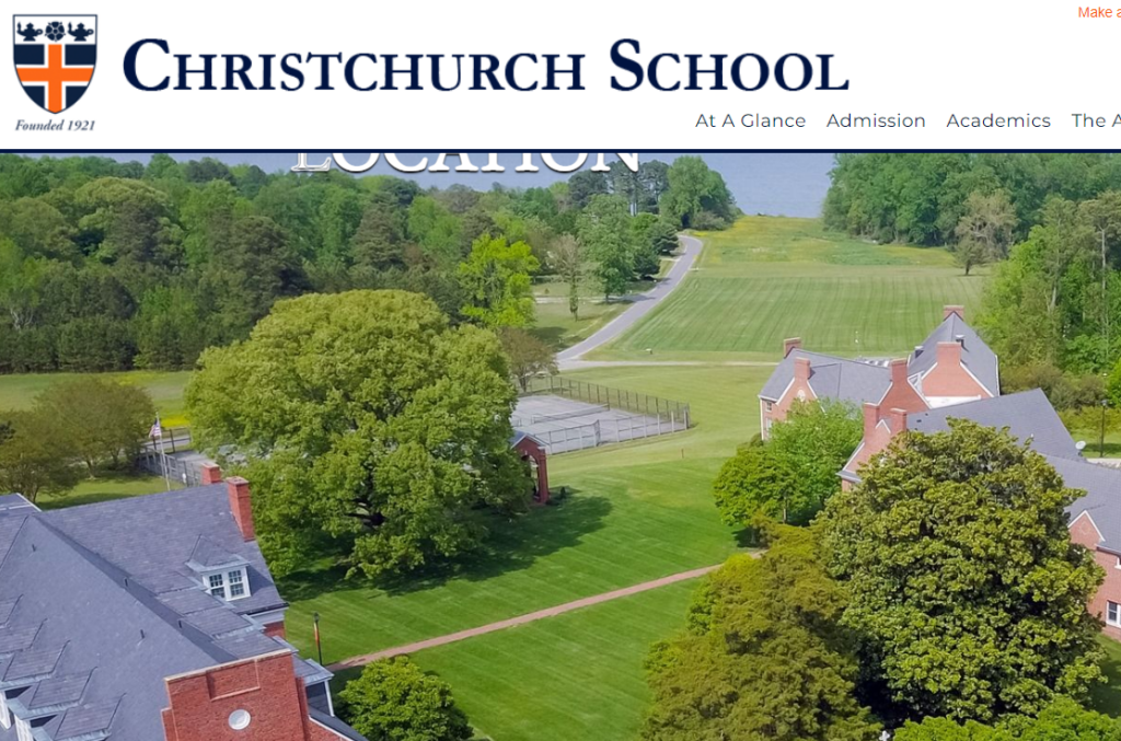 Aerial view of Christchurch School campus with red brick buildings, green lawns, large trees, and tennis courts, near a body of water. The school’s name and crest are visible at the top of the image.
