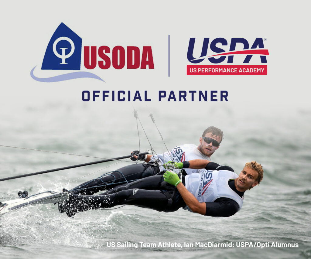 Two sailors leaning back in harnesses on a small sailboat, racing through water. Logos for USODA and US Performance Academy appear above the text 'Official Partner.' Names and titles are listed at the bottom.