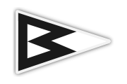 A triangular pennant with a white background and a bold black 'B' shape in the center, created by two black triangles pointing left inside the flag. The outline of the pennant is gray.