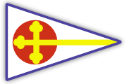 A triangular pennant with a blue border, featuring a large red circle on the left and a yellow cross with three rounded ends, extending horizontally across the flag. The background is white.