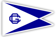 A triangular, white pennant flag with a blue border, featuring a blue 'G' inside a geometric shape on the left and blue triangles forming an hourglass shape in the center.